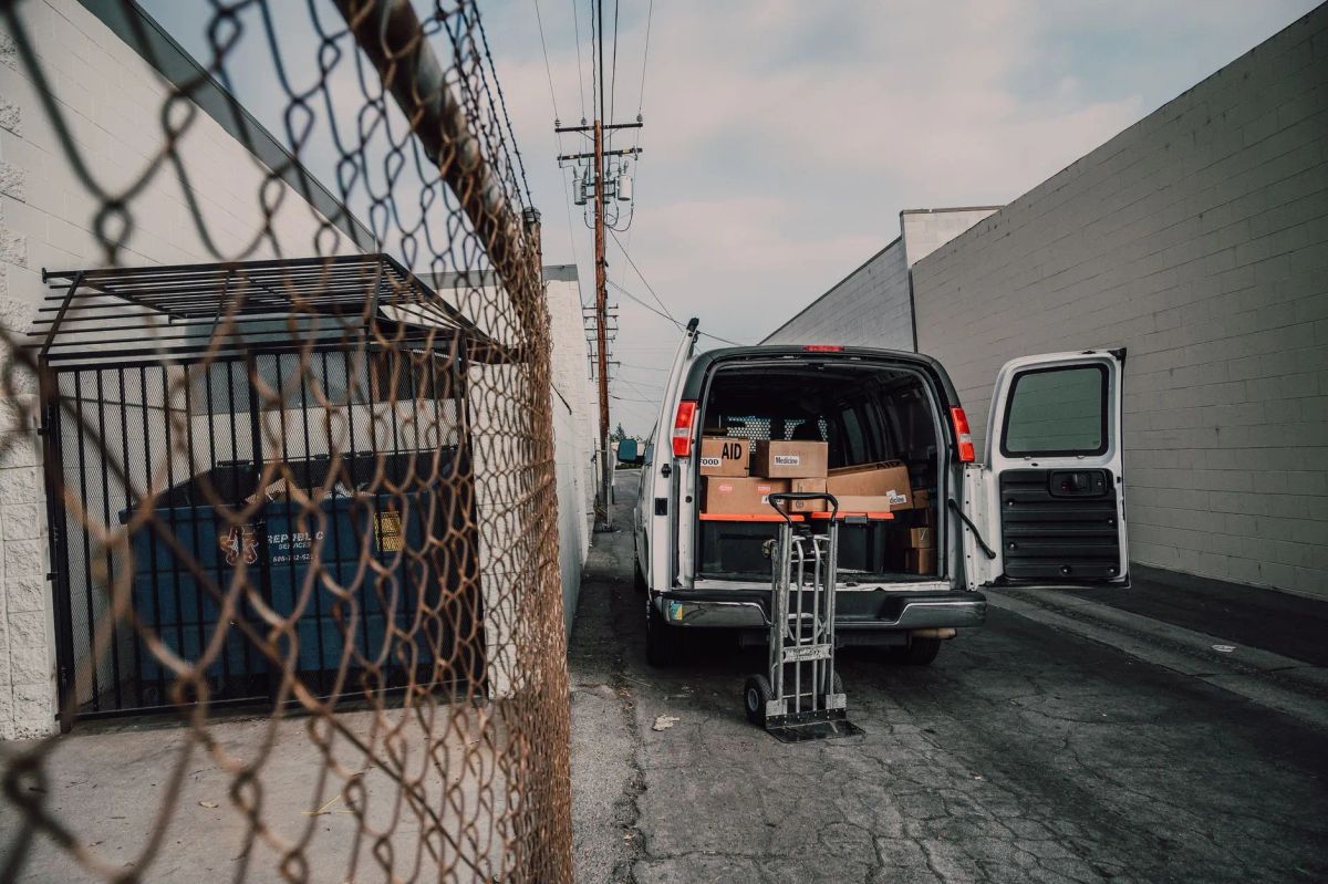Moving professionals loading furniture for a West Side Stamford apartment move