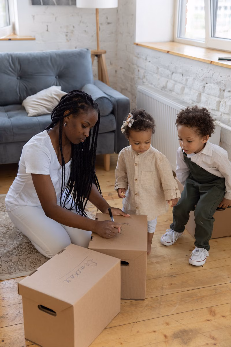 Carefully packed moving boxes arranged in a living room